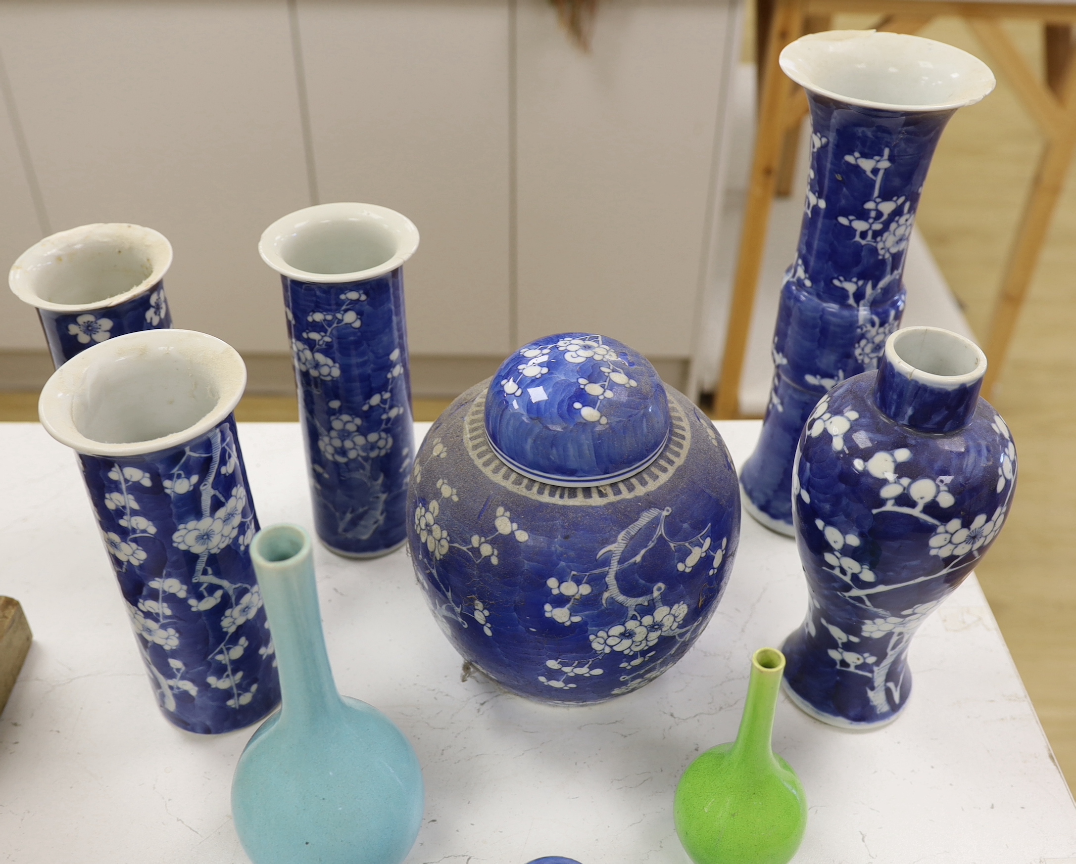 A collection of Chinese blue and white prunus vases and a jar and cover, a ko-sometsuke style dish and two bottle vases, tallest 30cm high (a.f.) (9)